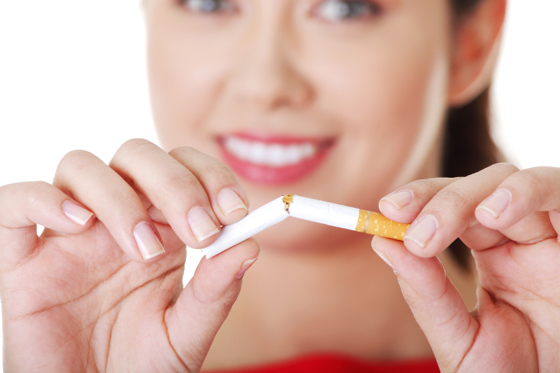 lady holding a broken cigarette