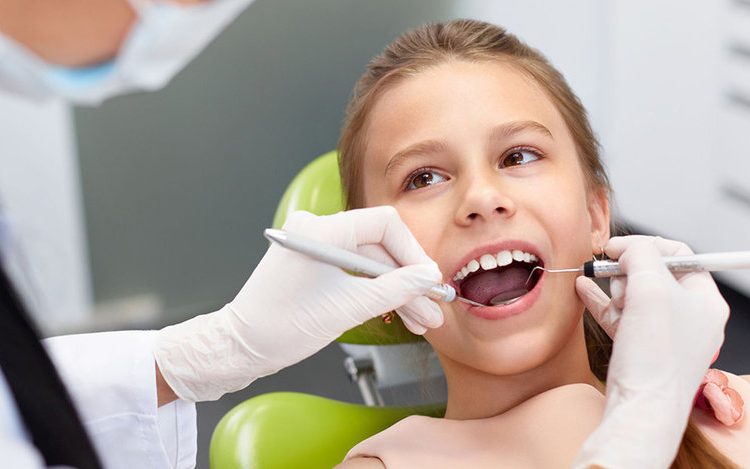 cleaning child's teeth