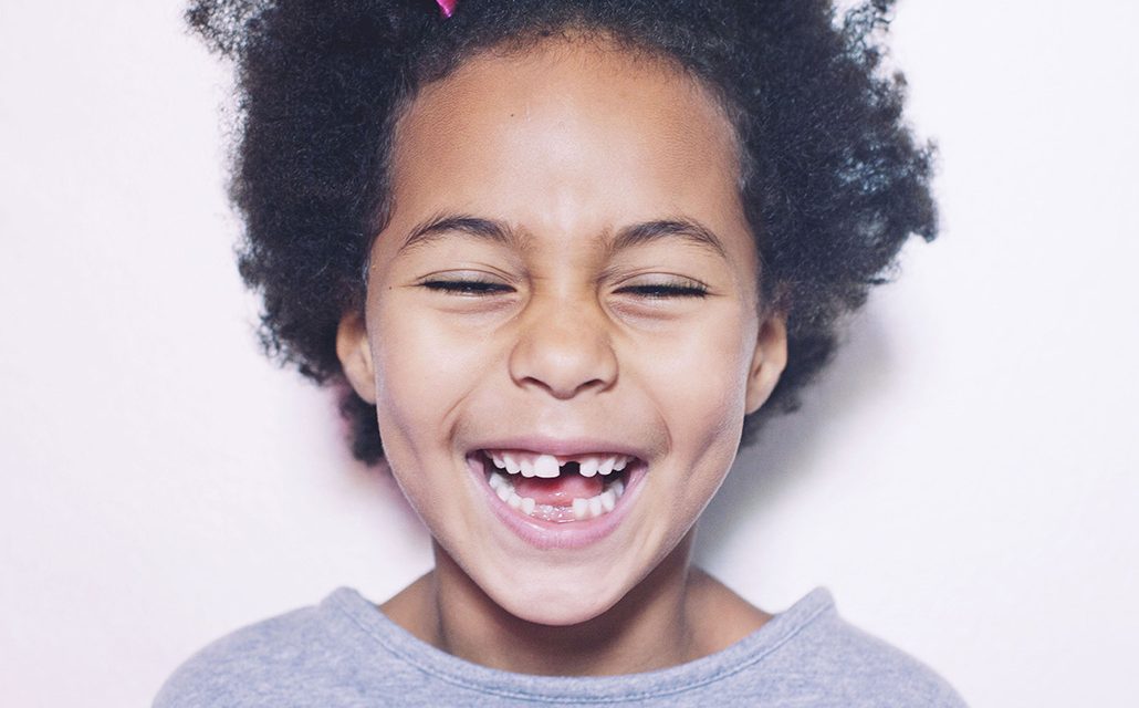 smiling child with gap teeth