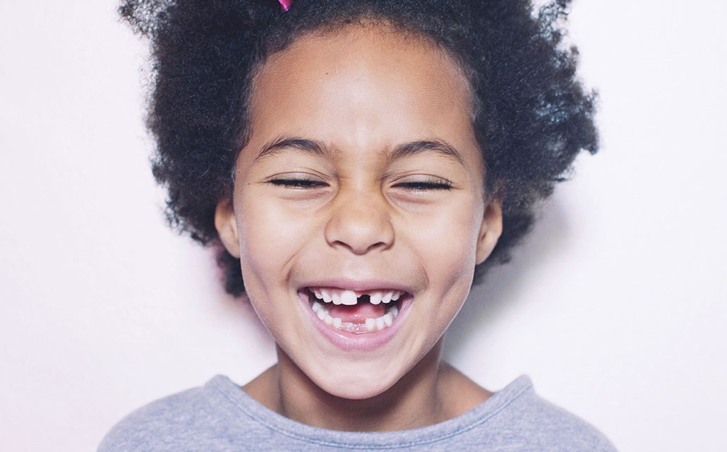 smiling child with teeth gap