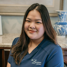 smiling girl wearing a blue shirt