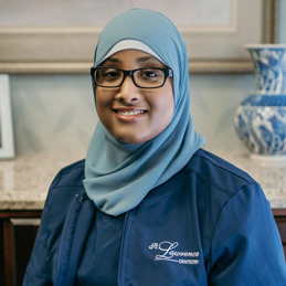 a girl wearing hijab and glasses