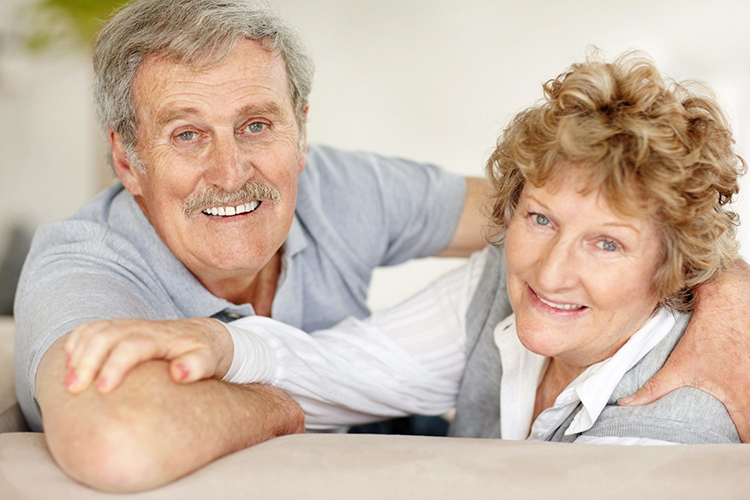 happy oldies couple wearing dentures