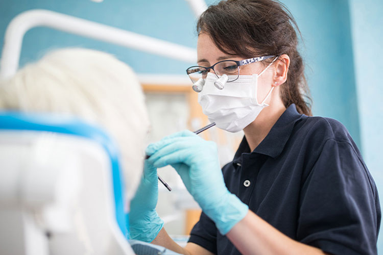 a dentist examining a patient mouth