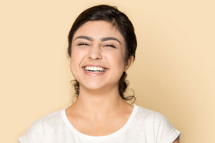 smiling woman with dental implant