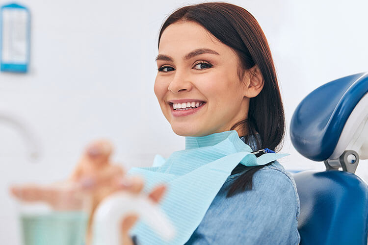 girl sitting in a dentist's clinic