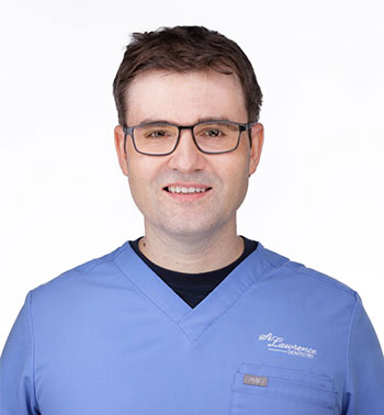 a man with a blue shirt and glasses
